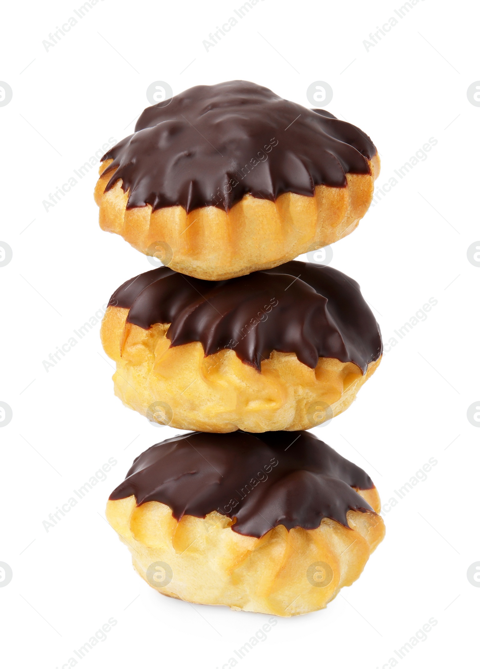 Photo of Delicious profiteroles with chocolate spread isolated on white