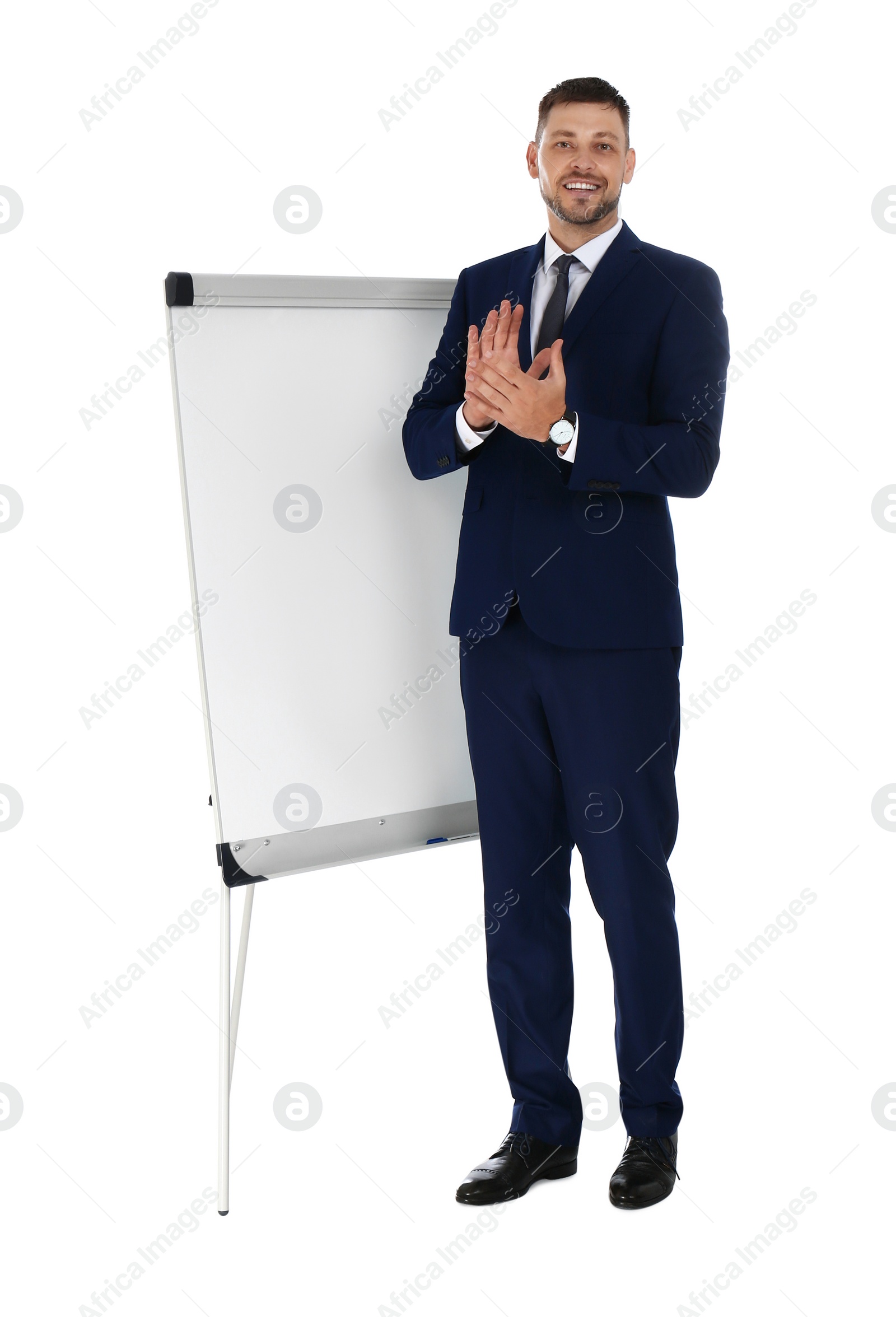 Photo of Professional business trainer near flip chart board on white background. Space for text