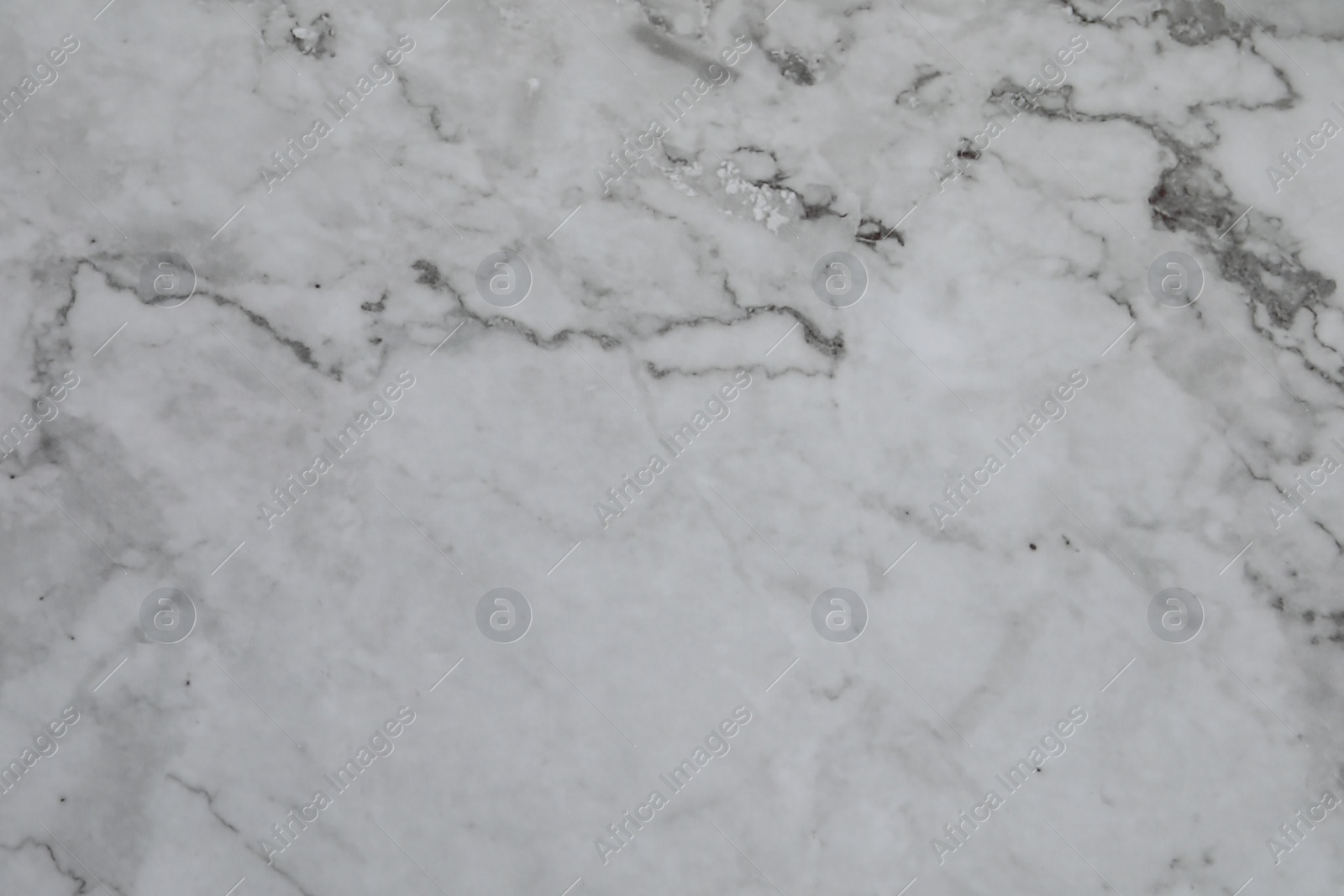 Photo of Texture of light grey marble surface as background, closeup