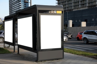Image of Bus stop with empty signboards in city. Mock-up for design