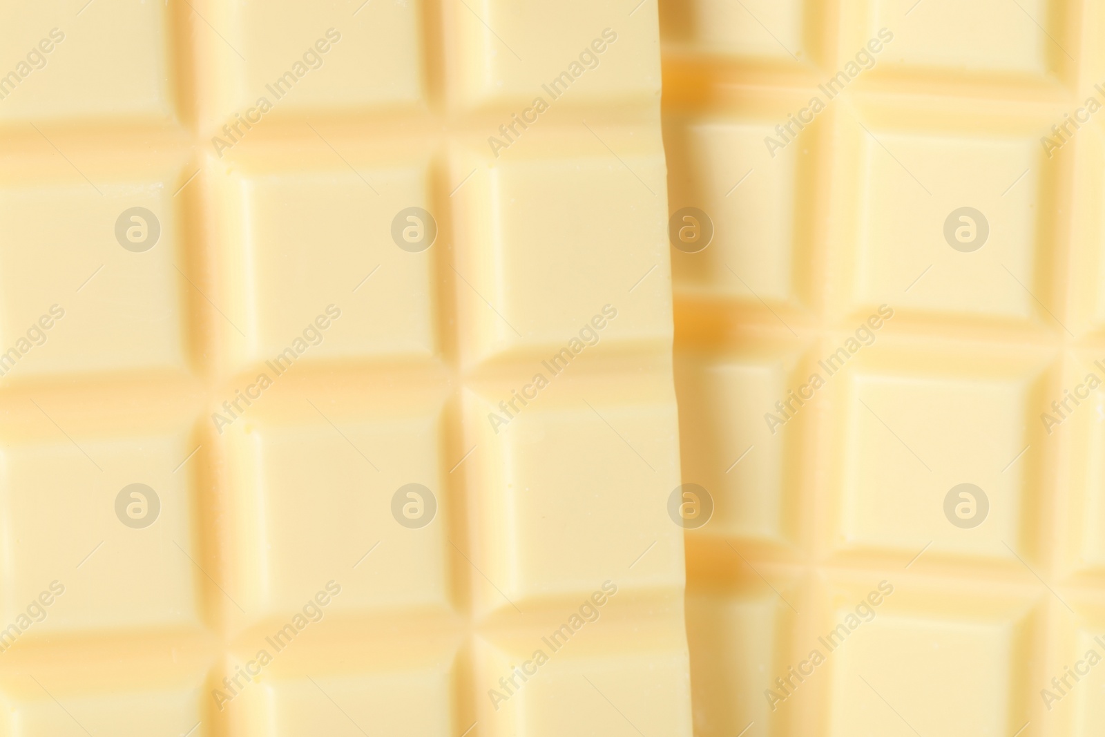 Photo of Delicious white chocolate as background, closeup view