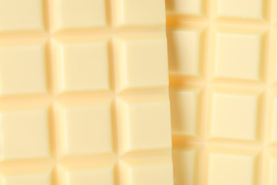 Photo of Delicious white chocolate as background, closeup view