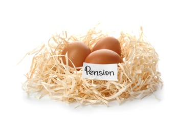 Eggs and card with word PENSION in nest on white background