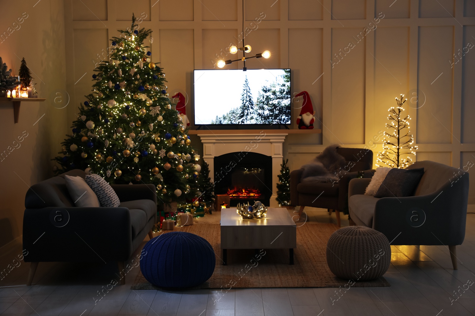 Photo of Cozy living room interior with beautiful Christmas tree near fireplace