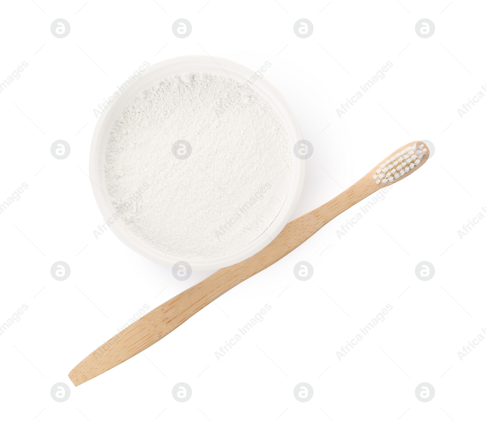 Photo of Bowl of tooth powder and brush on white background, top view