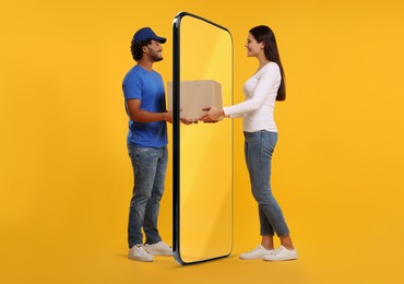 Image of Courier delivering parcel to woman through huge smartphone on orange background