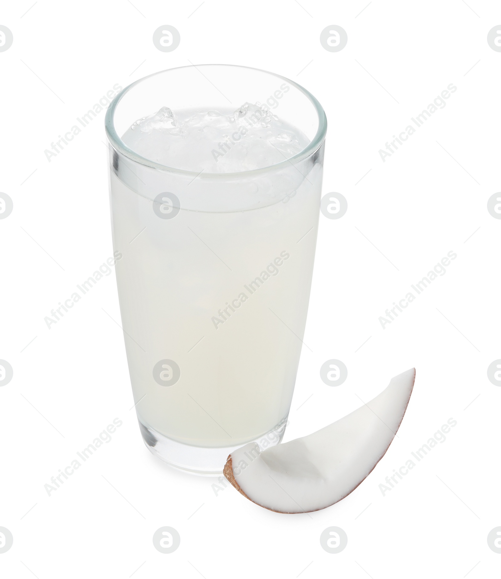 Photo of Glass of coconut water, ice cubes and nut isolated on white