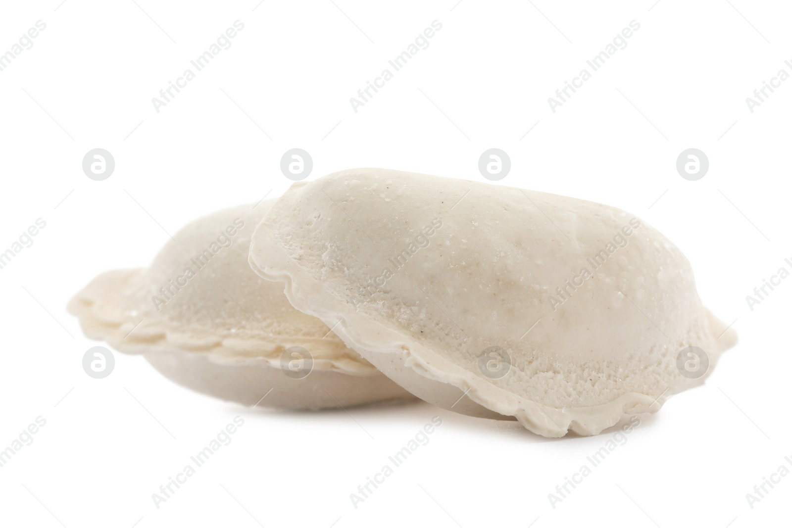 Photo of Raw dumplings with tasty filling on white background
