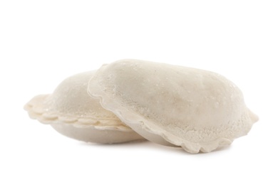 Photo of Raw dumplings with tasty filling on white background