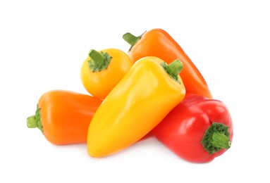 Photo of Heap of ripe bell peppers isolated on white
