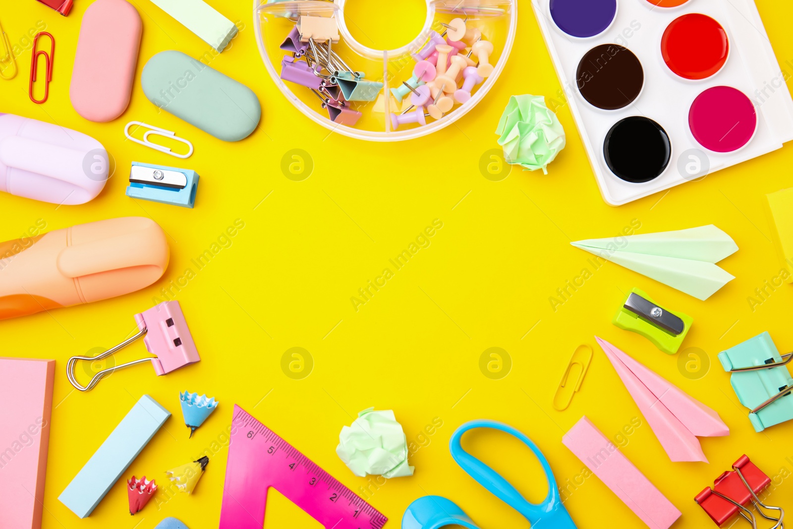 Photo of Flat lay composition with different school stationery on yellow background, space for text. Back to school