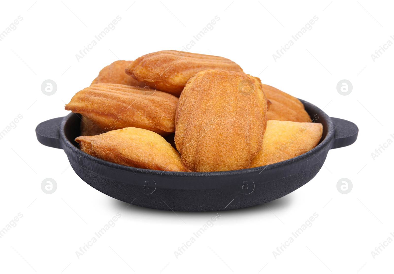 Photo of Frying pan with delicious madeleine cakes on white background