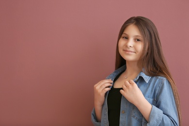 Photo of Attractive teenage girl on color background