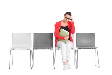 Young woman waiting for job interview on white background