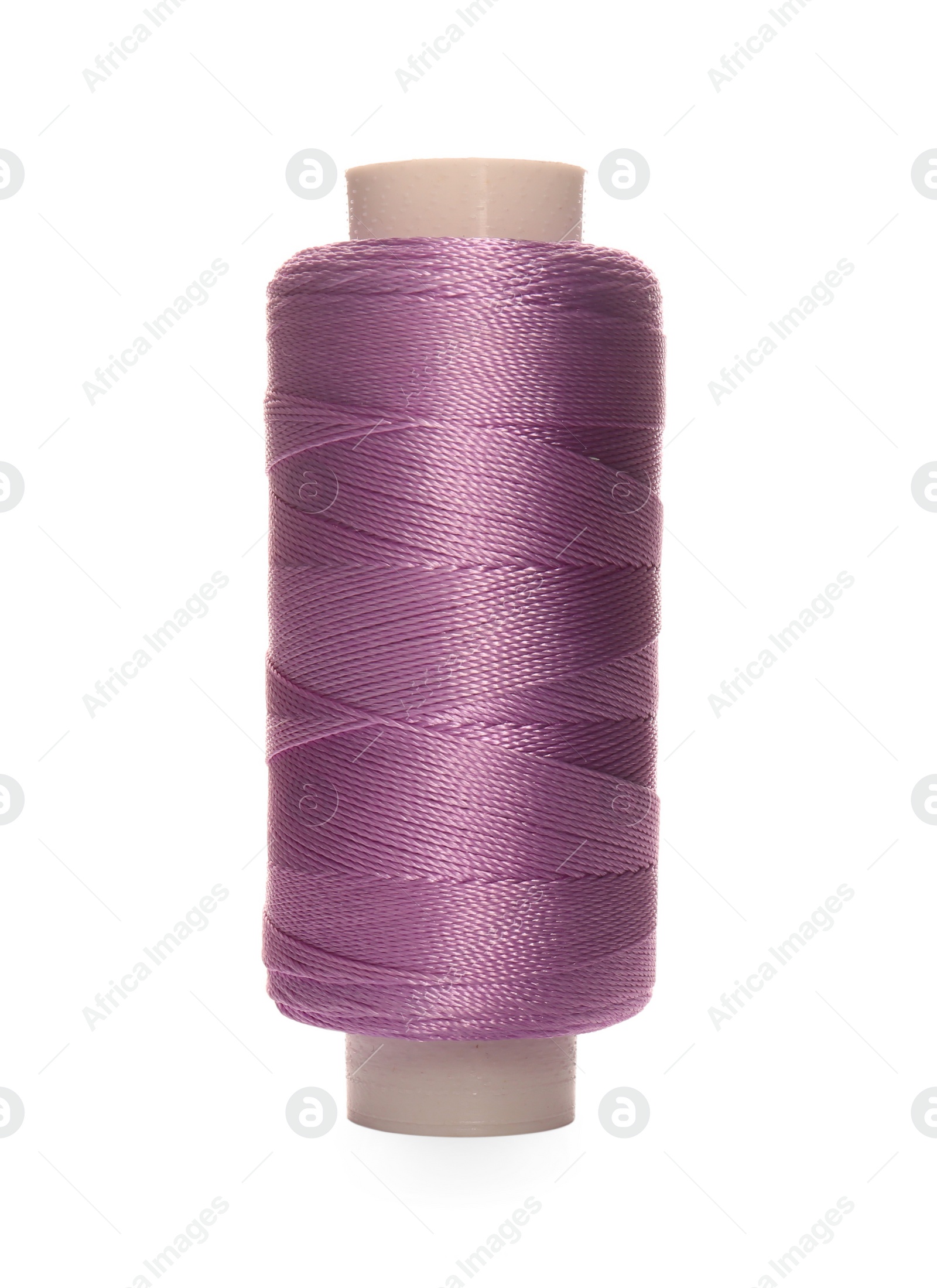 Photo of Spool of violet sewing thread isolated on white