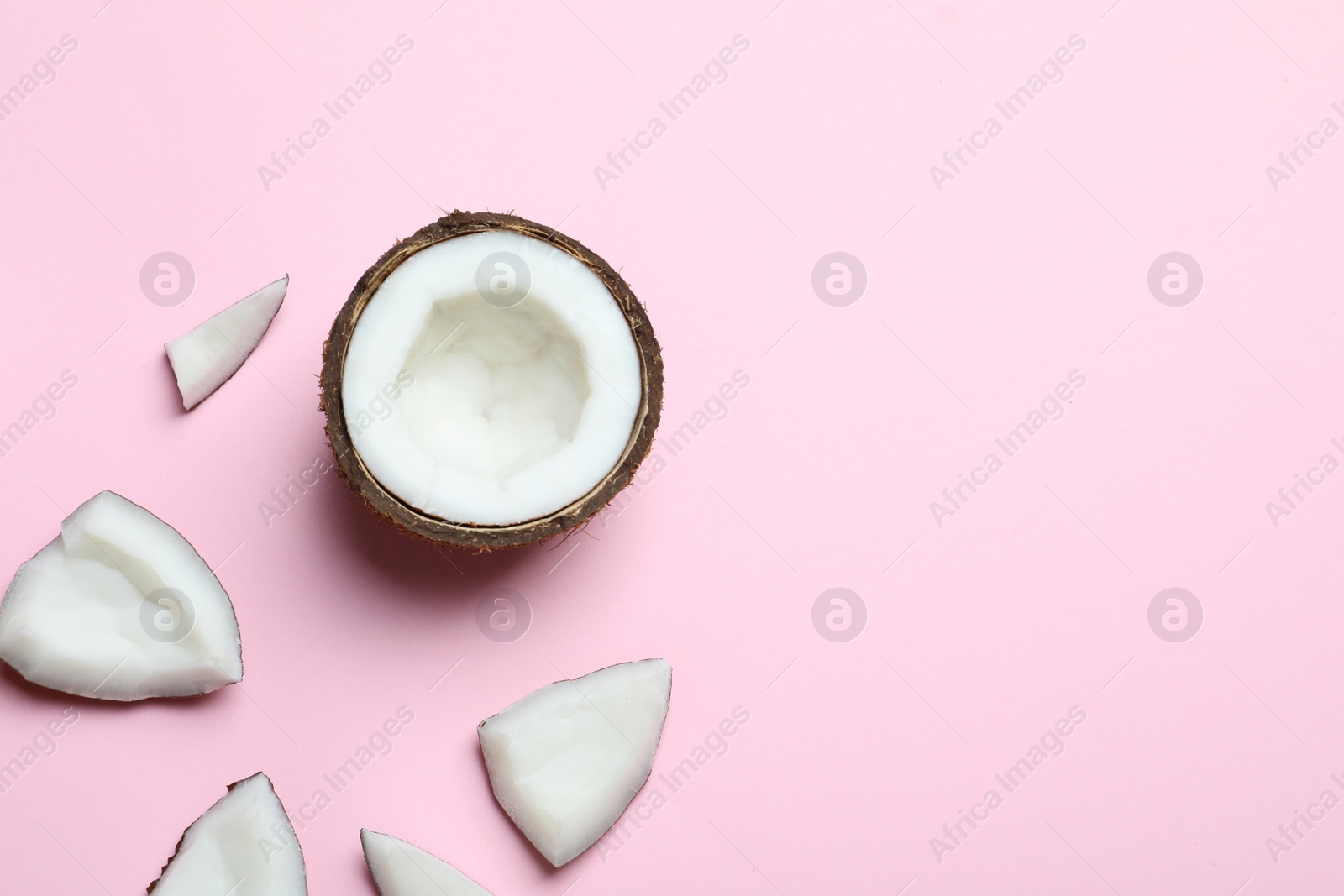 Photo of Ripe coconuts on color background, top view