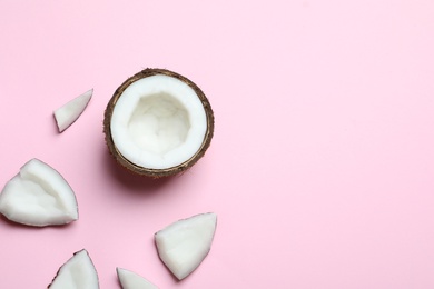 Photo of Ripe coconuts on color background, top view