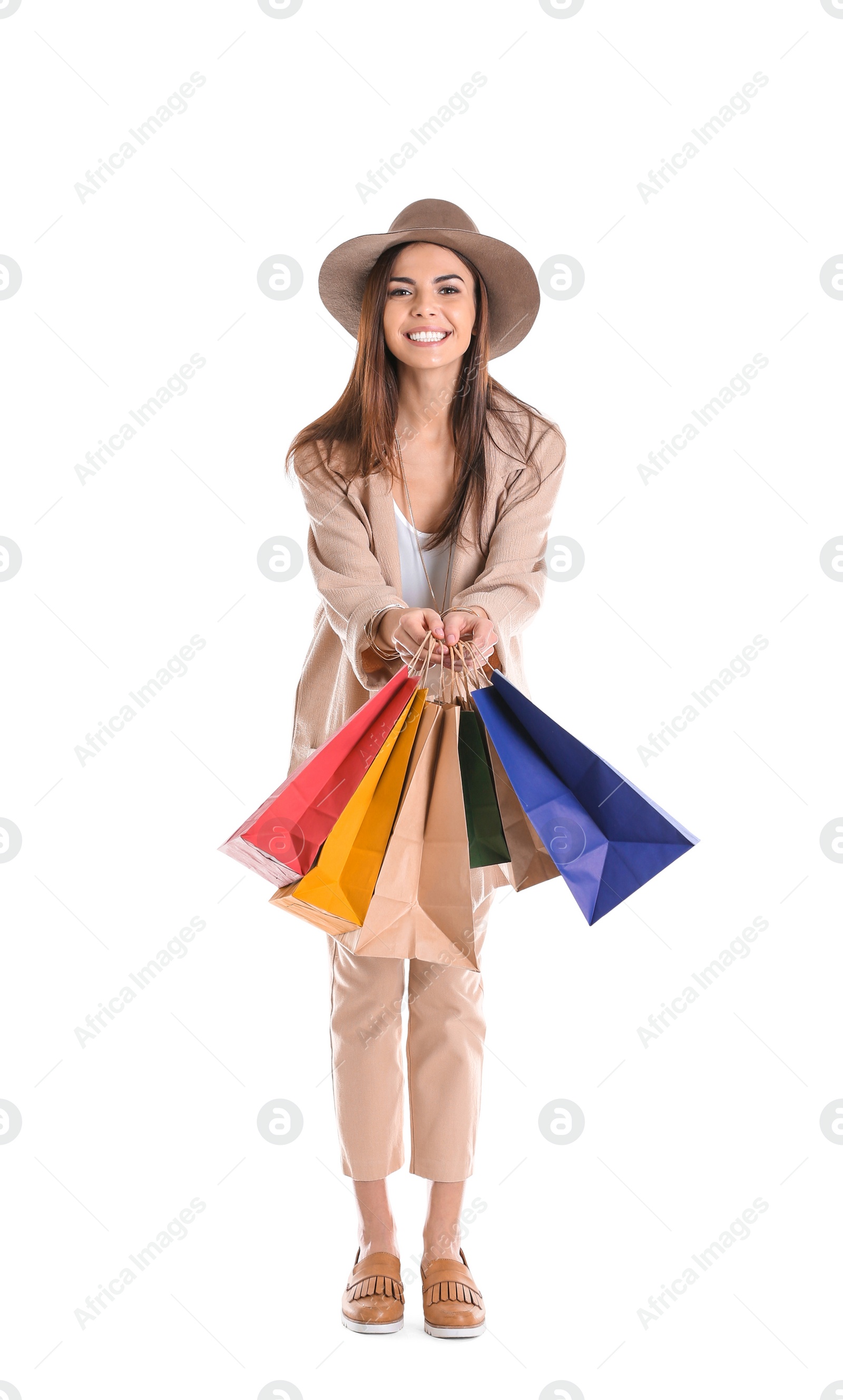 Photo of Young woman with shopping bags on white background