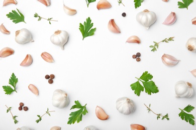 Photo of Flat lay composition with garlic on light background