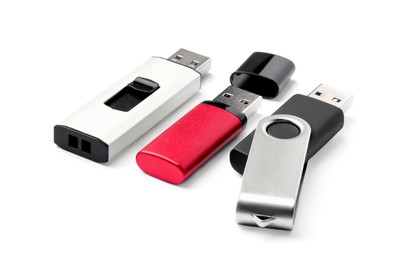 Photo of Different usb flash drives on white background