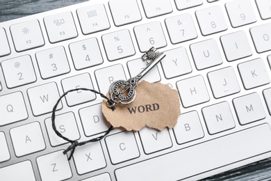Photo of Key with tag WORD on computer keyboard, top view. Keyword concept