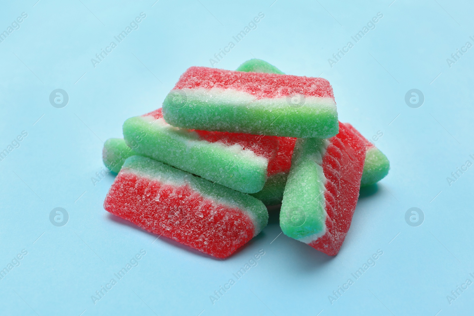 Photo of Pile of tasty jelly candies on color background