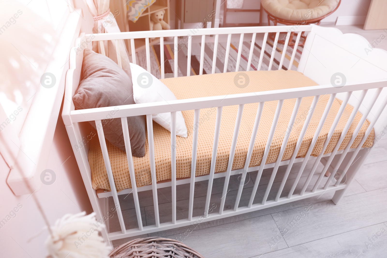 Photo of Baby room interior with comfortable crib