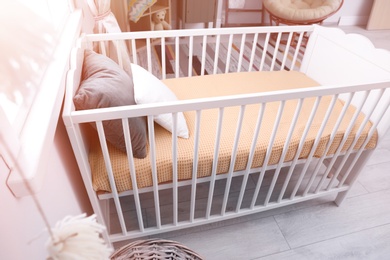 Baby room interior with comfortable crib