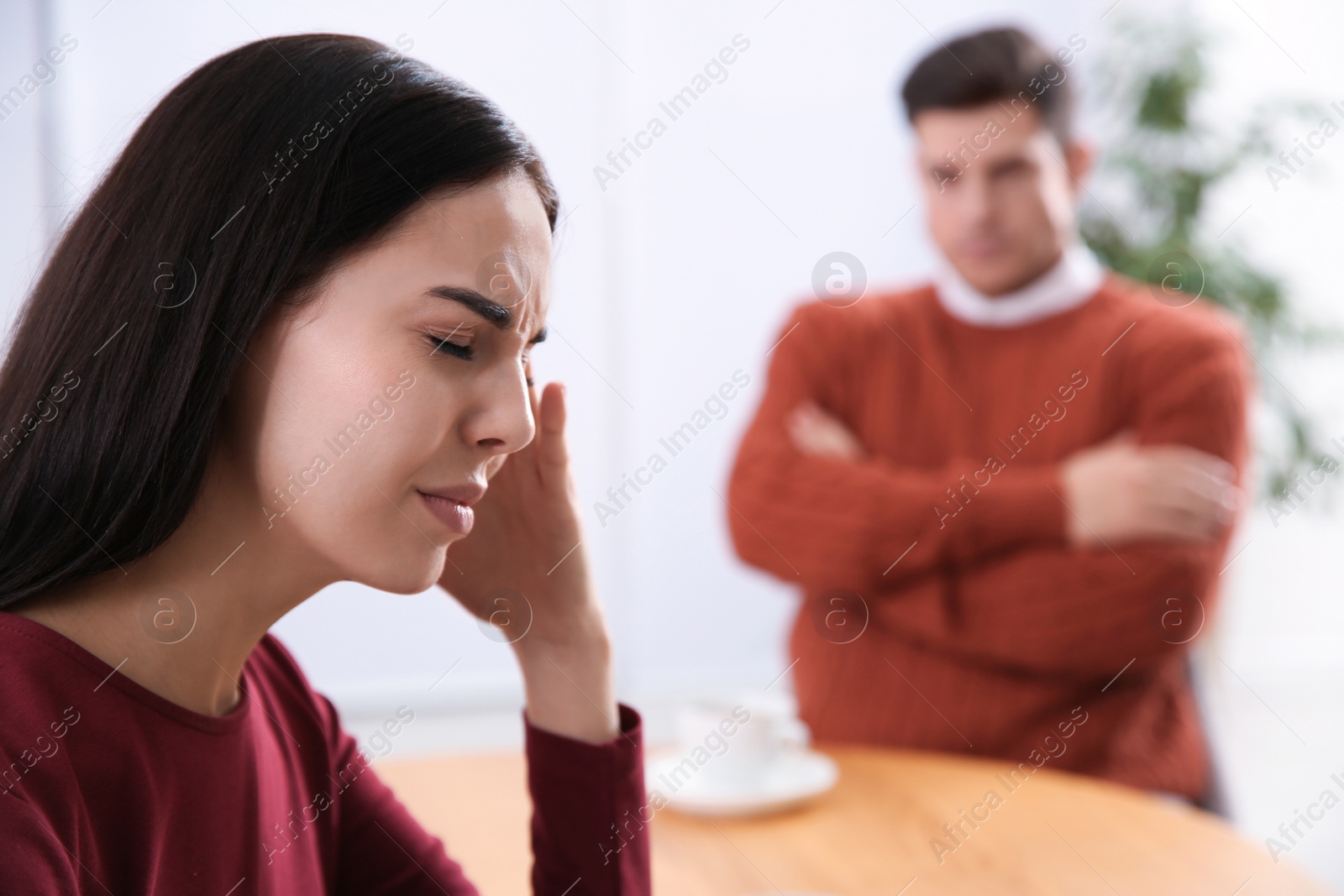 Photo of Unhappy woman after quarrel with her boyfriend in cafe. Relationship problems