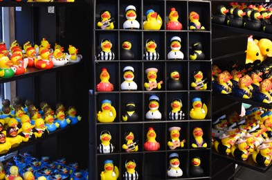 Photo of Amsterdam, Netherlands - June 18, 2022: Many toys on shelves in Duck Store