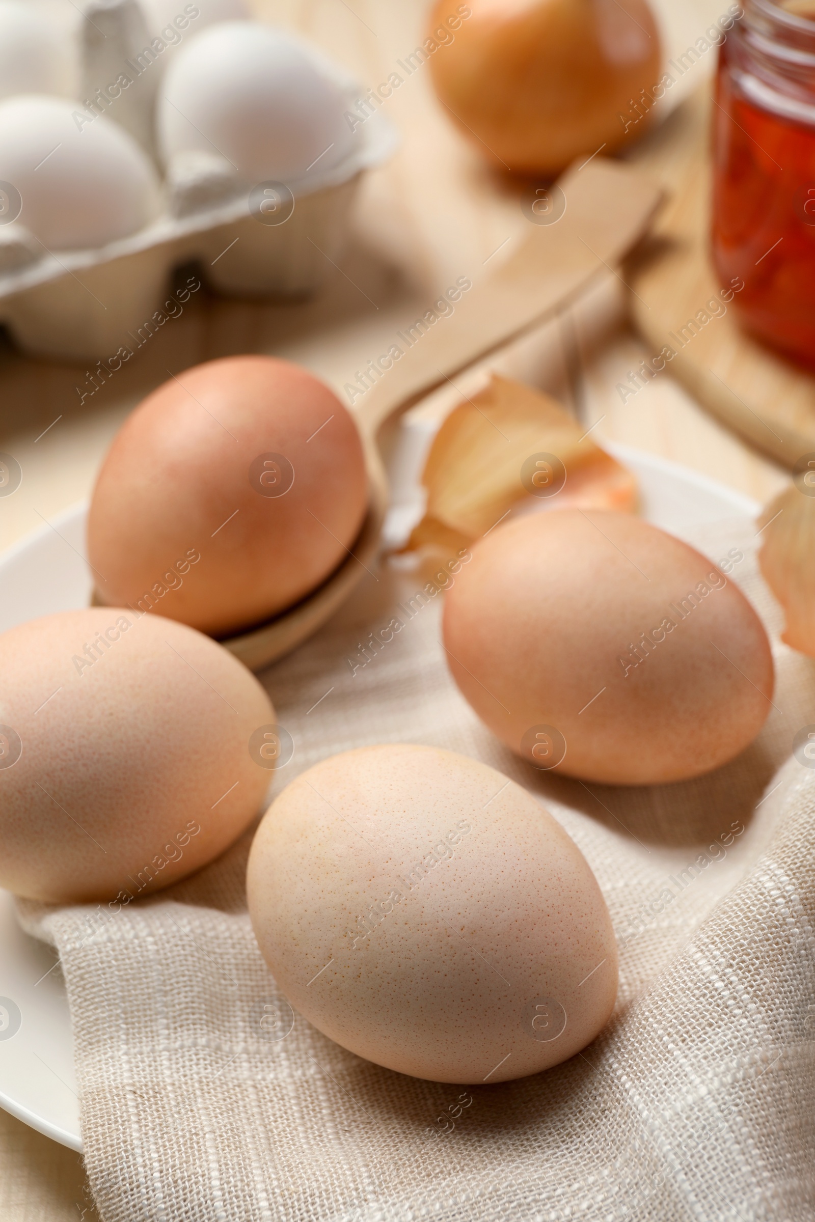 Photo of Easter eggs painted with natural dye on table, closeup