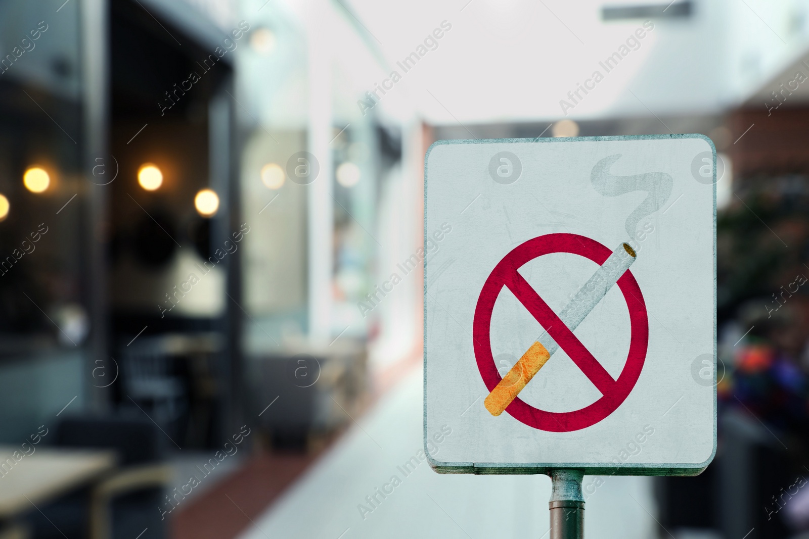 Image of Sign No Smoking in shopping mall. Space for text