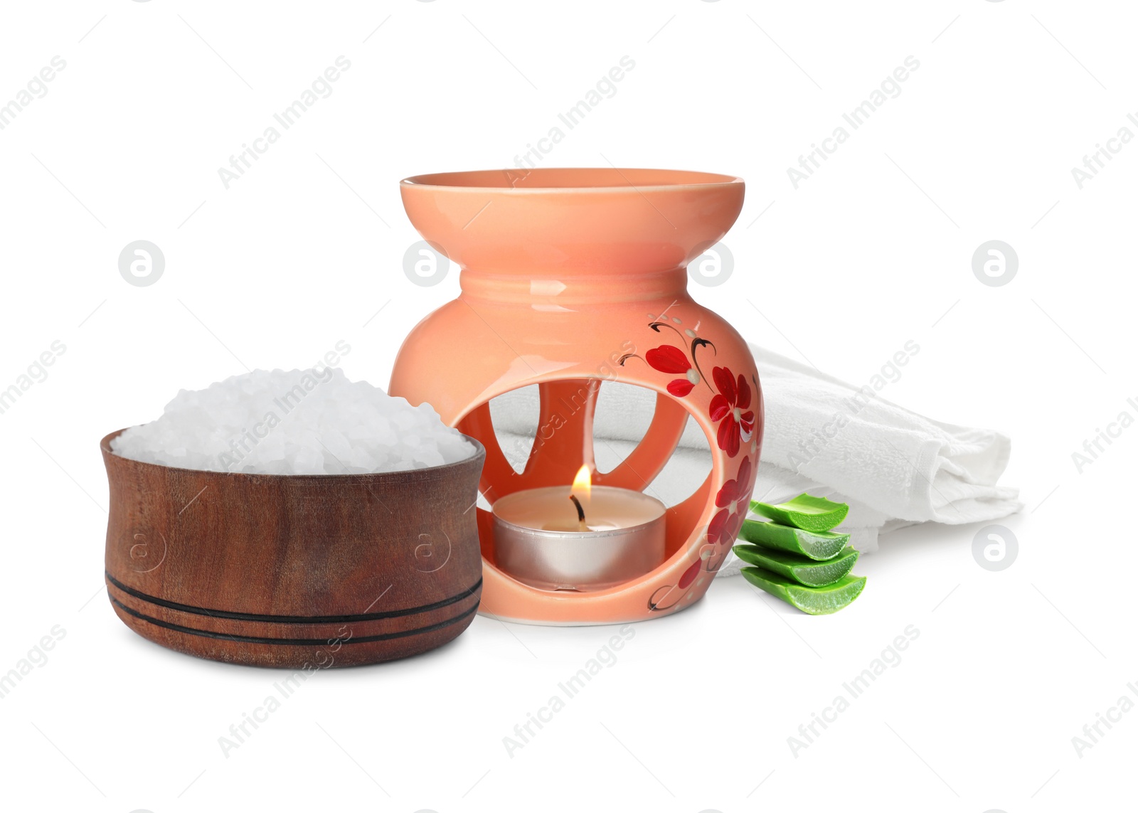 Image of Beautiful composition with folded towels, aroma lamp and bowl of sea salt on white background. Spa therapy