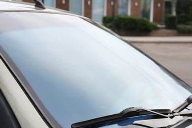 Modern car with tinting foil on window, closeup