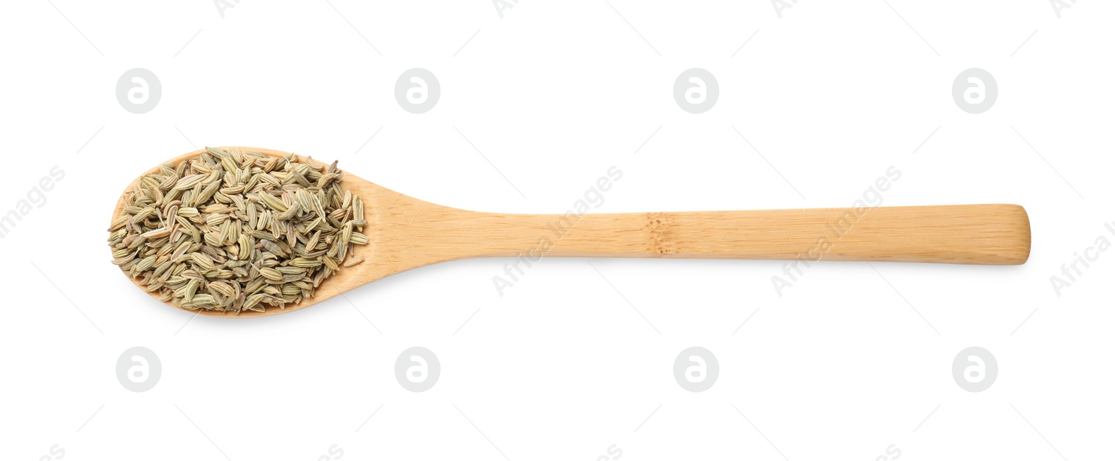 Photo of Dry fennel seeds in spoon isolated on white, top view