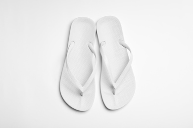 Pair of flip flops on white background, top view. Beach accessories