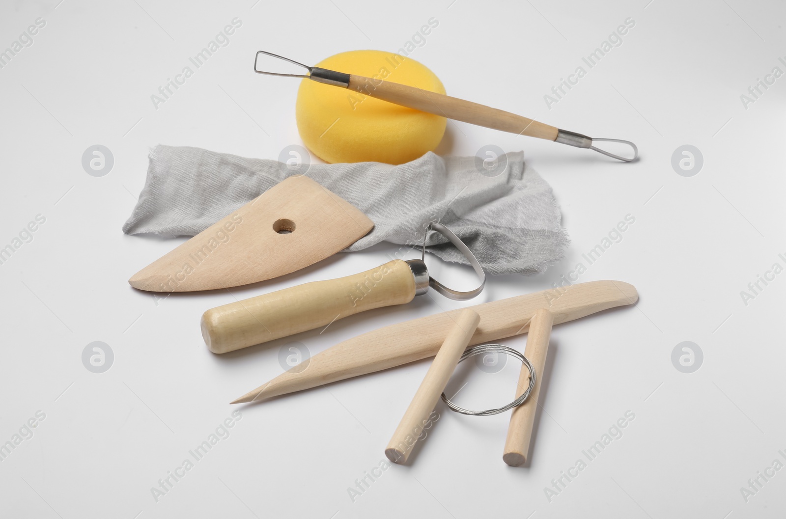 Photo of Set of clay modeling tools on white background