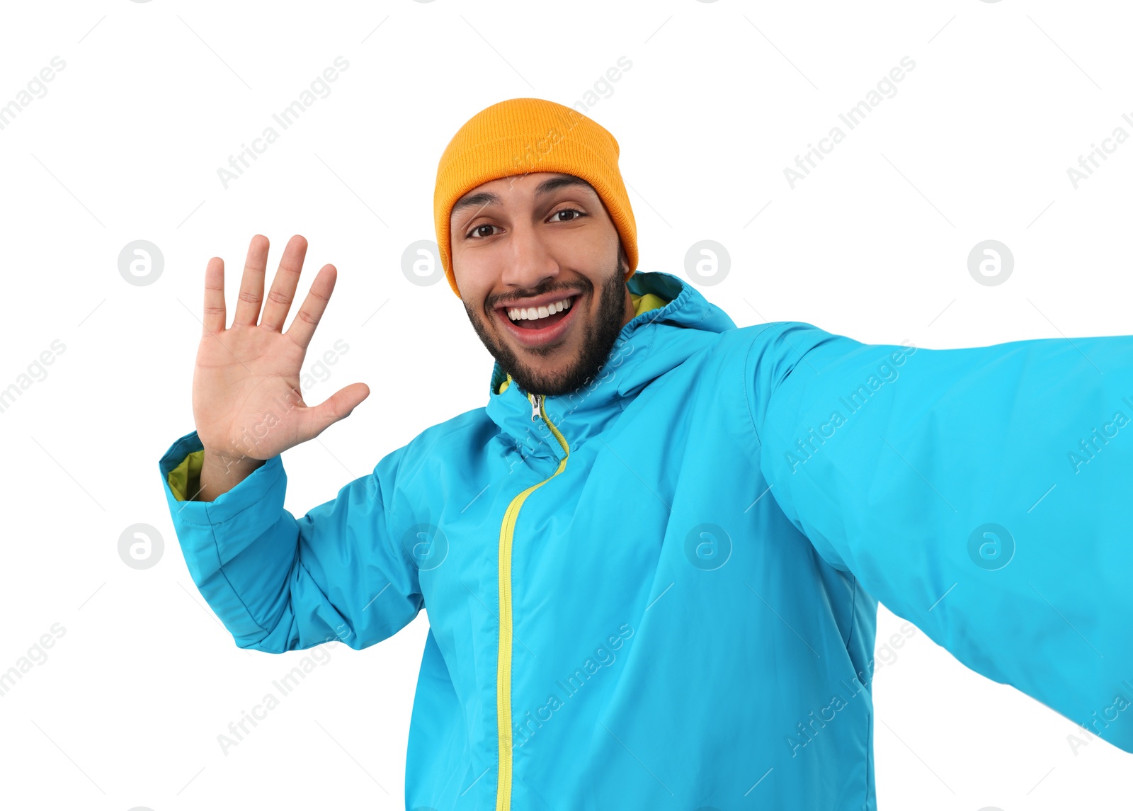 Photo of Smiling young man taking selfie on white background