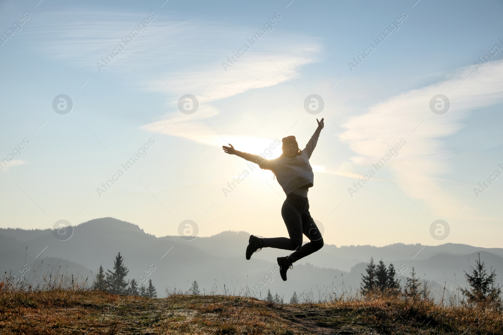 Photo of Young woman training outdoors at sunrise, space for text. Fitness lifestyle