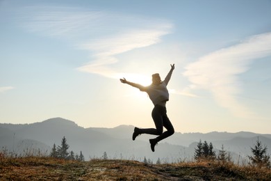 Young woman training outdoors at sunrise, space for text. Fitness lifestyle