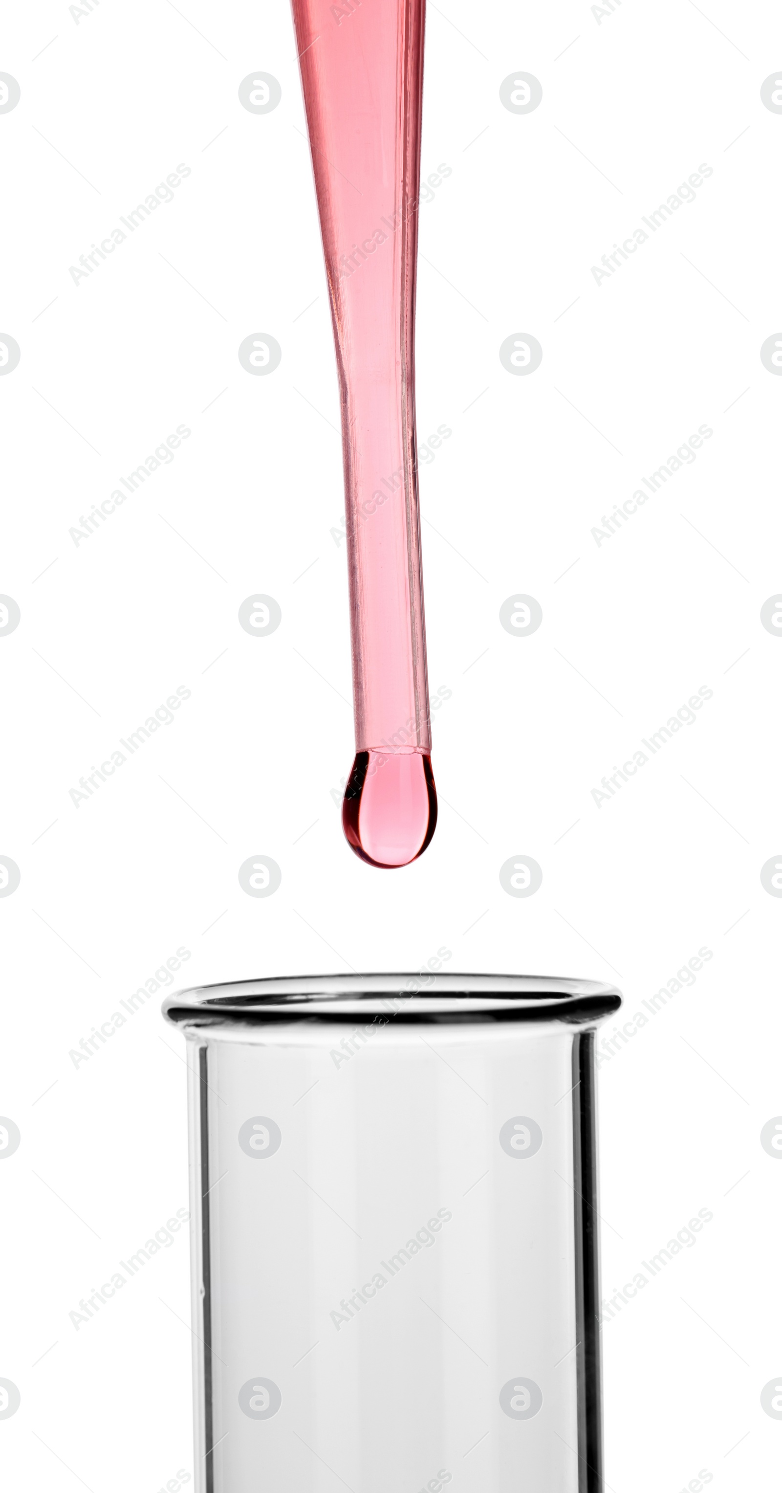 Photo of Dripping liquid from pipette into test tube on white background, closeup