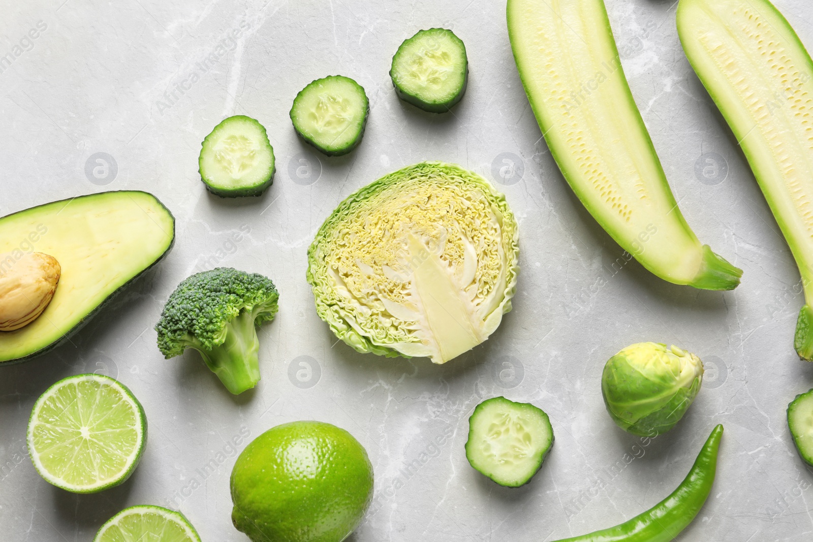 Photo of Flat lay composition with fresh vegetables and fruits on light background