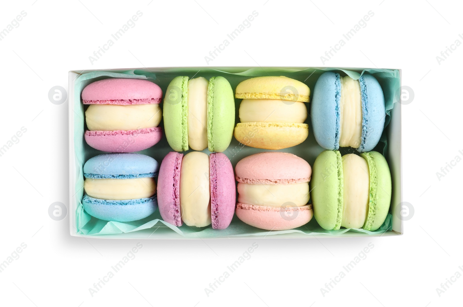 Photo of Many delicious colorful macarons in box on white background, top view