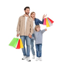 Photo of Family shopping. Happy parents and son with many colorful bags on white background
