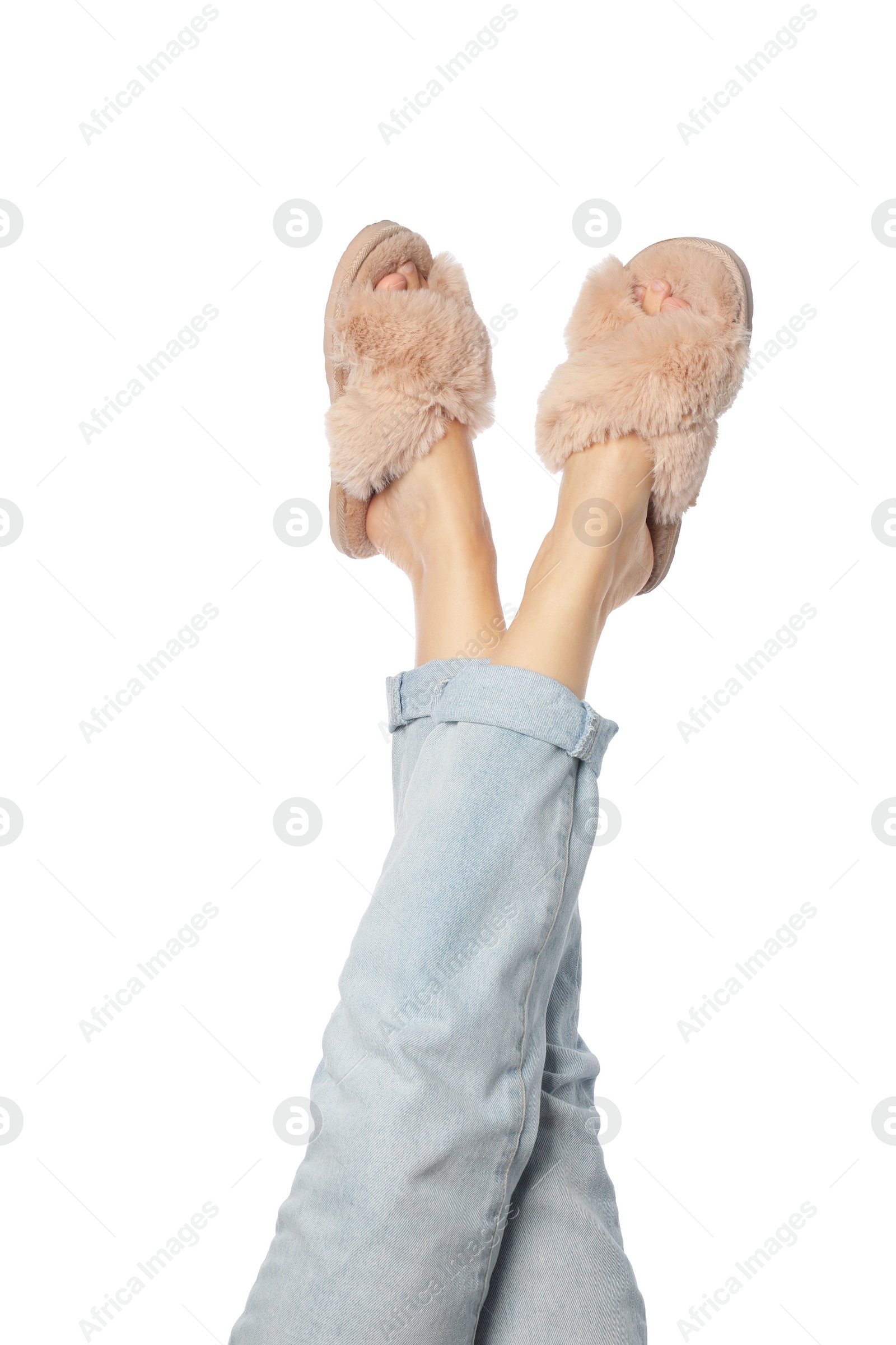 Photo of Woman in beige fluffy slippers on white background, closeup