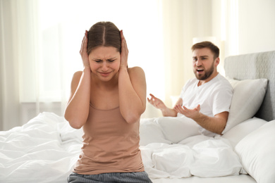 Unhappy young couple quarreling at home. Relationship problems