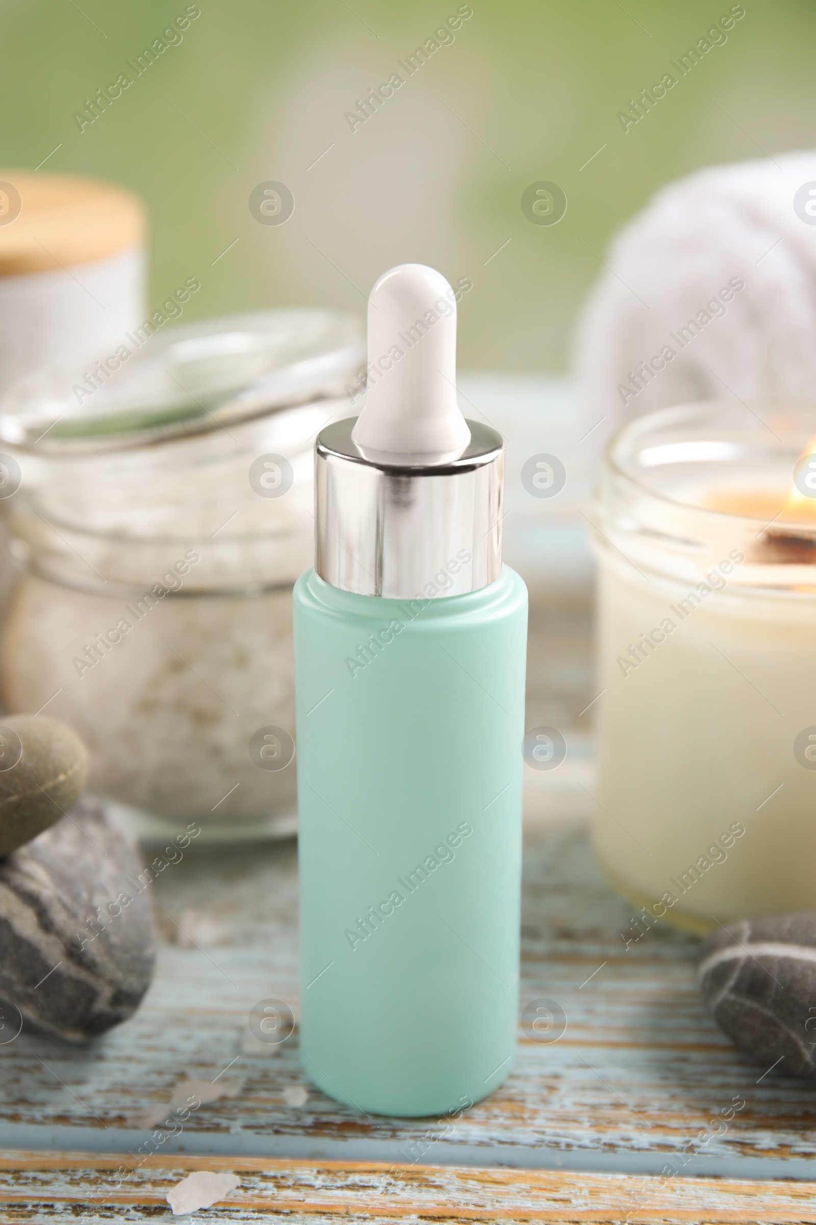 Photo of Composition with spa cosmetic on light wooden table, closeup