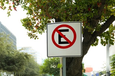 Road sign No Parking on city street. Traffic rules