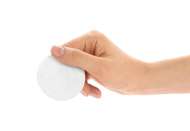 Photo of Woman holding cotton pad on white background, closeup