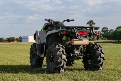 Photo of Modern quad bike in field on sunny day